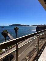 a view of the ocean from a balcony with a road at Appartement panoramique sur mer in Toulon