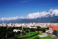 a view of a city with mountains in the background at Zhileju Homestay in Hualien City