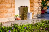 a group of potted plants sitting on a patio at Southern Sun Homestay North in Kenting