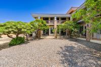 a large house with trees in front of it at Southern Sun Homestay North in Kenting