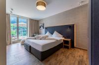 Łóżko lub łóżka w pokoju w obiekcie Adler Resort