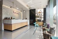 a restaurant lobby with a counter and chairs at S&amp;E Hotel in Tainan