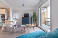 a living room with a couch and a table at Pierrick - Studio wifi et gare in Le Mans