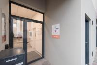 a glass door in a building with a sign on it at Pierrick - Studio wifi et gare in Le Mans