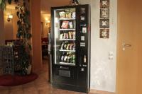 a black refrigerator filled with lots of drinks at Hotel Zur Sonne in Waren