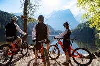 a group of three people on bikes overlooking a lake at Hotel Garni Löwen in Silz