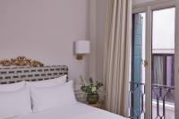 a bedroom with a white bed and a window at Violino d&#39;Oro Venezia in Venice