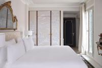 a white bedroom with a white bed and a window at Violino d&#39;Oro Venezia in Venice