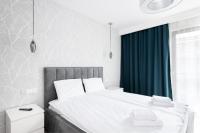 Posteľ alebo postele v izbe v ubytovaní Flatbook - City Center SPA Apartments Toruńska