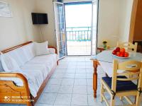 Postel nebo postele na pokoji v ubytování Evangelia House Sea View Apartments