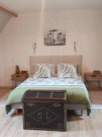Tempat tidur dalam kamar di Ailes et Iles