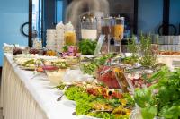 a buffet line with a lot of food on it at Hotel Wolin in Międzyzdroje