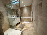 a bathroom with a shower and a sink and a tub at Le Nid d&#39;Ars in Ars-en-Ré