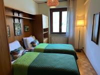 Posteľ alebo postele v izbe v ubytovaní Villa Rosina Terrazzo