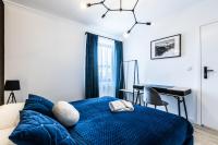 Postel nebo postele na pokoji v ubytování Apartamenty Krupówki 48B