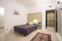 A bed or beds in a room at Hotel Buonconsiglio