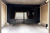 a black gate with a window in a building at Chaleureux et Cosy proche Gare in Massy