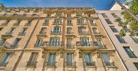 a tall building with balconies on the side of it at GuestReady - Beautiful Apt near Paris Zoo in Paris