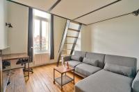 a living room with a couch and a ladder at GuestReady - Beautiful Apt near Paris Zoo in Paris