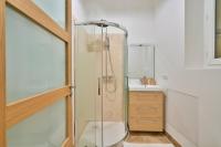 a bathroom with a shower with a toilet and a sink at GuestReady - Beautiful Apt near Paris Zoo in Paris