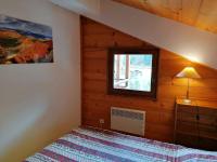 a bedroom with a bed and a window at Appartement Le Grand-Bornand, 3 pièces, 6 personnes - FR-1-241-61 in Le Grand-Bornand