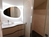 a bathroom with a sink and a mirror at Appartement Le Grand-Bornand, 3 pièces, 6 personnes - FR-1-241-61 in Le Grand-Bornand