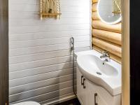 a bathroom with a sink and a toilet at Holiday Home Tiira by Interhome in Himahuuha