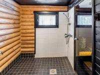 a bathroom with a shower stall and a window at Holiday Home Tiira by Interhome in Himahuuha