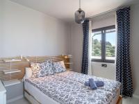 Postel nebo postele na pokoji v ubytování Holiday Home Melon by Interhome
