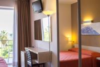 A bed or beds in a room at Hotel Villa d'Amato