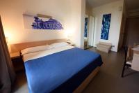 A bed or beds in a room at Hotel Villa d'Amato