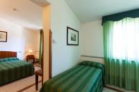 A bed or beds in a room at Hotel Villa d'Amato