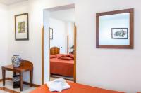 A bed or beds in a room at Hotel Villa d'Amato