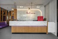 a lobby of a store with a reception desk at S&amp;E Hotel in Tainan