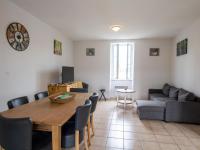a living room with a table and a couch at Appartement Saint-Mesmin, 3 pièces, 5 personnes - FR-1-616-213 in Saint-Mesmin