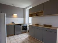 a kitchen with stainless steel appliances and gray cabinets at Appartement Saint-Mesmin, 3 pièces, 5 personnes - FR-1-616-213 in Saint-Mesmin