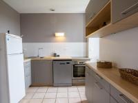 a kitchen with white cabinets and a white refrigerator at Appartement Saint-Mesmin, 3 pièces, 5 personnes - FR-1-616-213 in Saint-Mesmin
