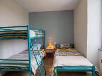 two bunk beds in a small room with a lamp at Appartement Saint-Mesmin, 3 pièces, 5 personnes - FR-1-616-213 in Saint-Mesmin