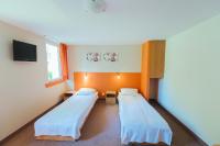 Posteľ alebo postele v izbe v ubytovaní Hotel Pod Sosnami
