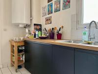 a kitchen with a sink and a counter top at Bienvenue in Montrouge