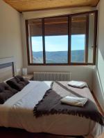 Postel nebo postele na pokoji v ubytování Apartamentos Mirador de Gúdar