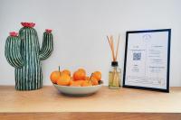 a bowl of oranges sitting on a table next to a cactus at Luxury Cocon by Les Maisons de Charloc Homes in Boulogne-Billancourt