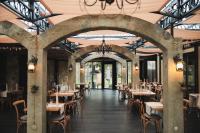 an empty dining room with tables and chairs at Hotel Bernarda in Varaždinske Toplice