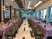 a row of tables and chairs in a banquet hall at Hanvet Hotel Do Son in Ðố Sơn