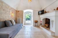 A seating area at Trullo Fedele Grande125 - Happy Rentals
