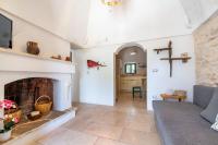 A seating area at Trullo Fedele Grande125 - Happy Rentals