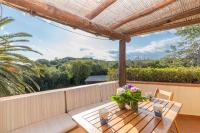 A balcony or terrace at Blue&Green House With Shared Pool - Happy Rentals