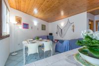 A seating area at Blue&Green House With Shared Pool - Happy Rentals