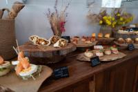 a table with different types of food on display at Can Jaume by Ocean Drive in Ibiza Town