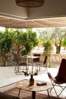 a room with chairs and a table and a table and chairs at Can Jaume by Ocean Drive in Ibiza Town